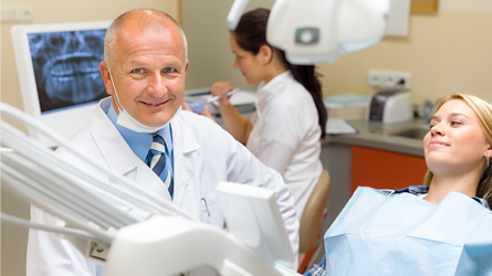 Dentist Working With Patient